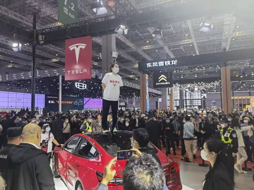 Zhang said she was protesting after the company refused to release her vehicle’s full data from the crash and refused a to issue a refund. Photo: Baidu Zhang said she was protesting after the company refused to release her vehicle’s full data from the crash and refused a to issue a refund. Photo: Baidu