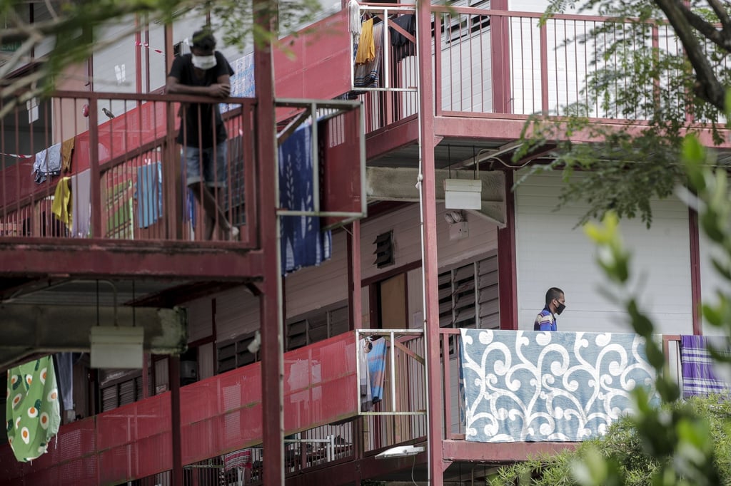 Migrant workers are seen in a dormitory in Singapore in April last year. Photo: EPA Migrant workers are seen in a dormitory in Singapore in April last year. Photo: EPA