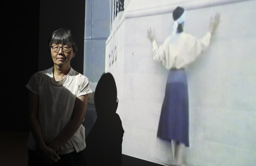 May Fung Mei-wah and her 1989 work, She Said Why Me, part of an exhibition of five women artists at an exhibition at the M+ Pavilion in June 2019. Photo: Xiaomei Chen
