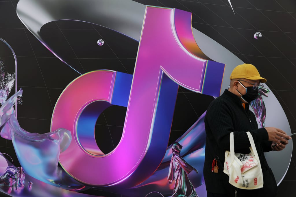 A man stands near a giant sign of Douyin, the Chinese sister app of ByteDance-owned TikTok, during China Fashion Week in Beijing on March 31, 2021. Photo: Reuters A man stands near a giant sign of Douyin, the Chinese sister app of ByteDance-owned TikTok, during China Fashion Week in Beijing on March 31, 2021. Photo: Reuters