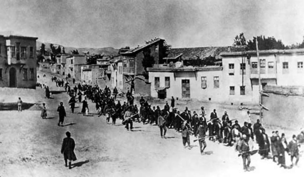 Armenian elite of the city of Harput, Turkey, being led away under armed guard in May 1915.
