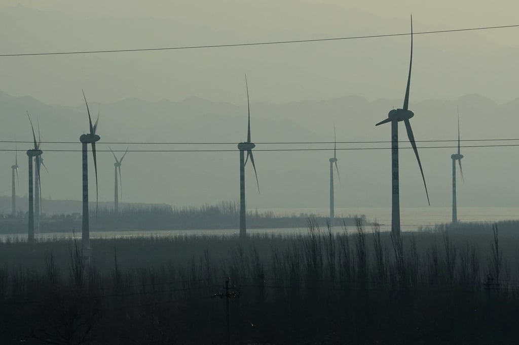 Windmills seen from a high-speed train travelling from Beijing to northwestern China’s Hebei province. President Xi Jinping pledged at a United Nations meeting in September that China would go carbon neutral by 2060. Photo: AP Windmills seen from a high-speed train travelling from Beijing to northwestern China’s Hebei province. President Xi Jinping pledged at a United Nations meeting in September that China would go carbon neutral by 2060. Photo: AP