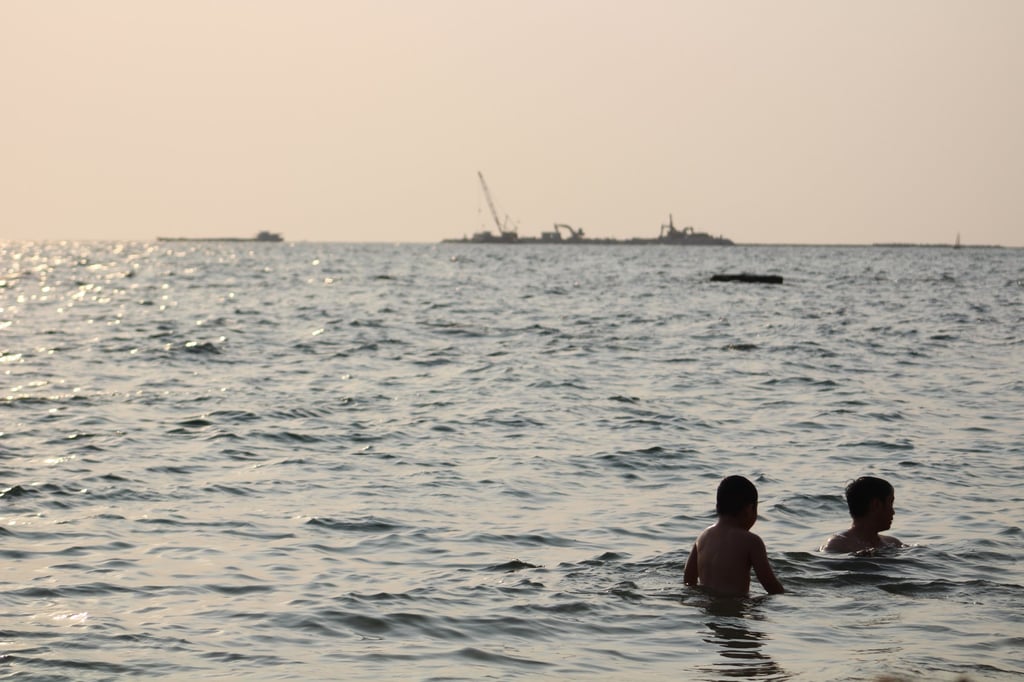 A father and son swim from a public beach on Phu Quoc island. Photo: Sen Nguyen.
