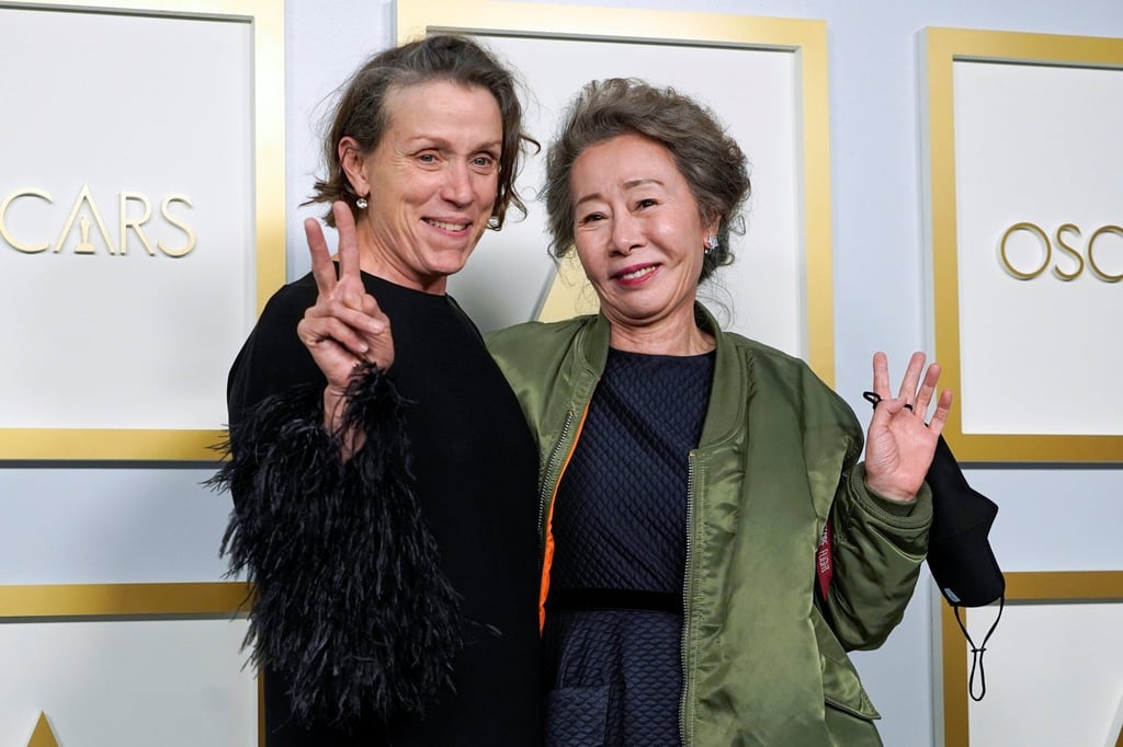 Youn Yuh-jung with Frances McDormand, winner of the award for best actress in a leading role for ‘Nomadland’. Photo: Chris Pizzello via Reuters