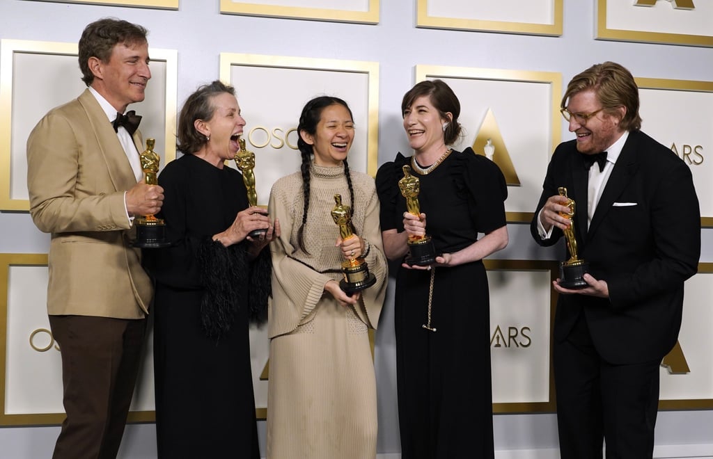 Nomadland producers (from left) Peter Spears, Frances McDormand, Chloe Zhao, Mollye Asher and Dan Janvey with their awards. Photo: EPA-EFE