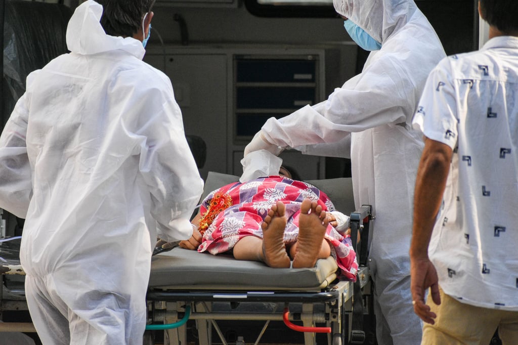 A Covid-19 patient is transferred to the intensive care unit of a hospital in Kolkata, India. The country hit record numbers of coronavirus infections worldwide for the sixth day running on Tuesday. Photo: dpa A Covid-19 patient is transferred to the intensive care unit of a hospital in Kolkata, India. The country hit record numbers of coronavirus infections worldwide for the sixth day running on Tuesday. Photo: dpa