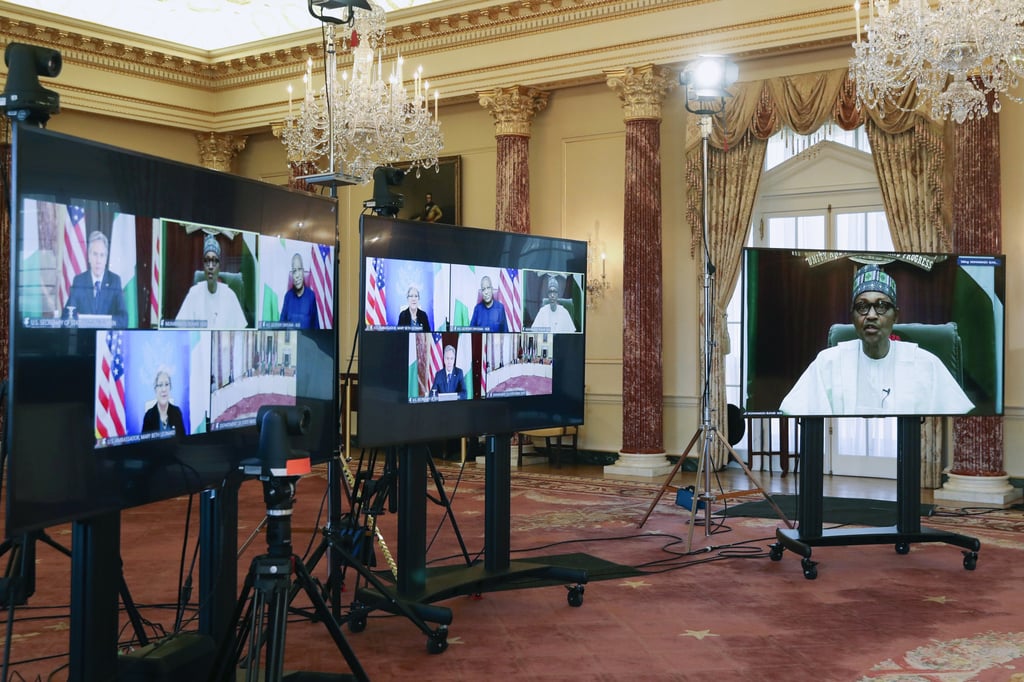 Nigeria’s President Muhammadu Buhari appears on a screen (at right) during a virtual bilateral meeting with US Secretary of State Antony Blinken in Washington on Tuesday. Photo: AP