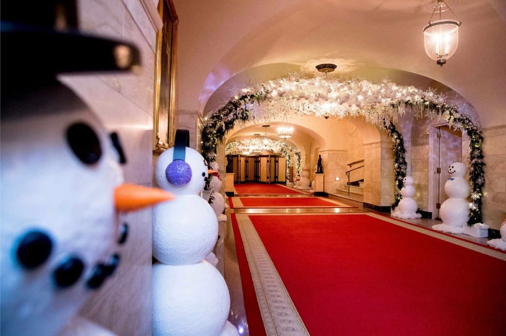 The Lower Cross Hall decorated with “snowball” arches, created from more than 6,000 ornaments, and snowmen lining the corridor in the White House during a preview of the 2016 holiday decor in November, 2016, in Washington. Photo: AP
