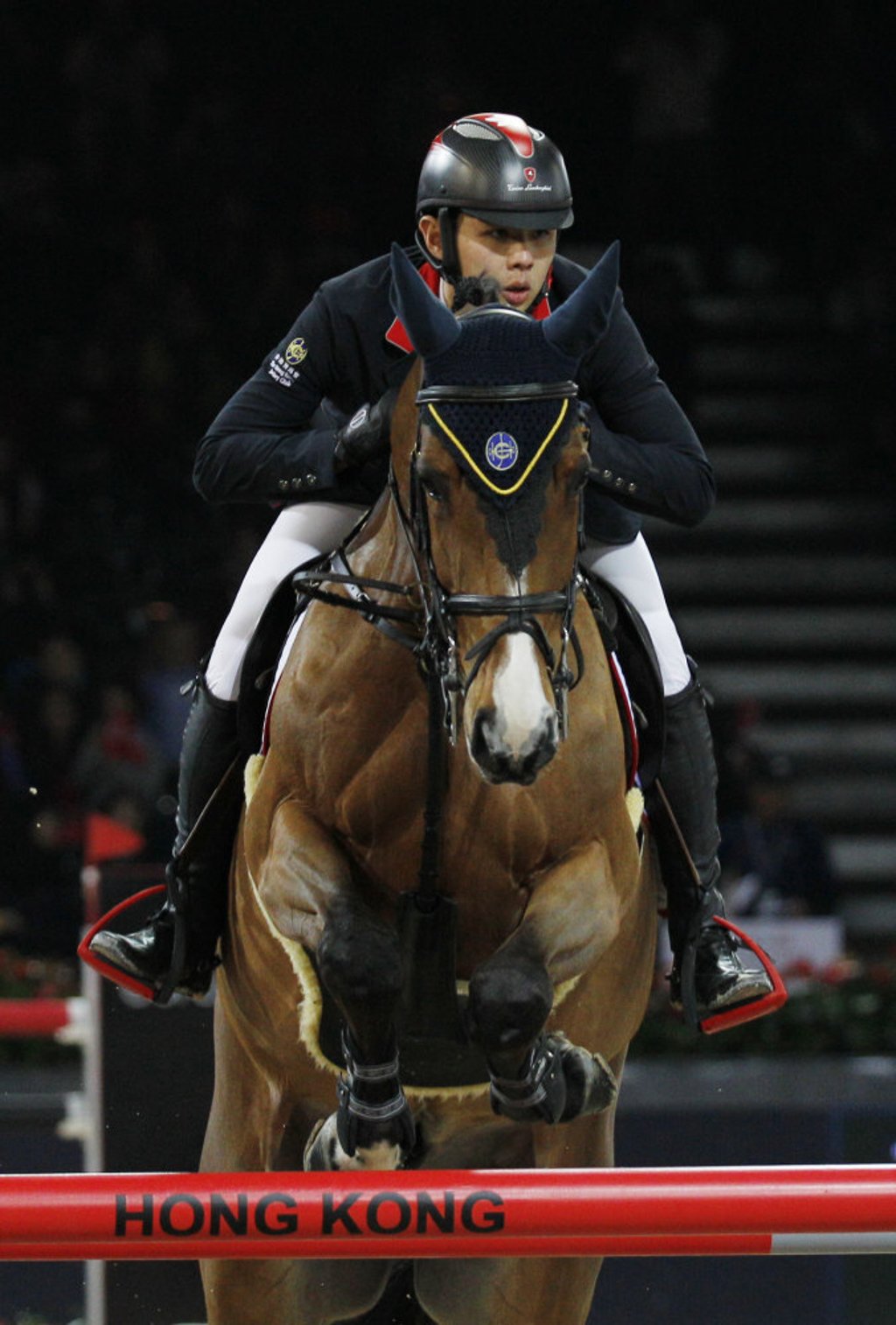 Kenneth Cheng and Balou clear a barrier during the Longines Speed Challenge (1.45m) at the Hong Kong Masters International jumping competition in Hong Kong in 2014. Photo: AP Kenneth Cheng and Balou clear a barrier during the Longines Speed Challenge (1.45m) at the Hong Kong Masters International jumping competition in Hong Kong in 2014. Photo: AP