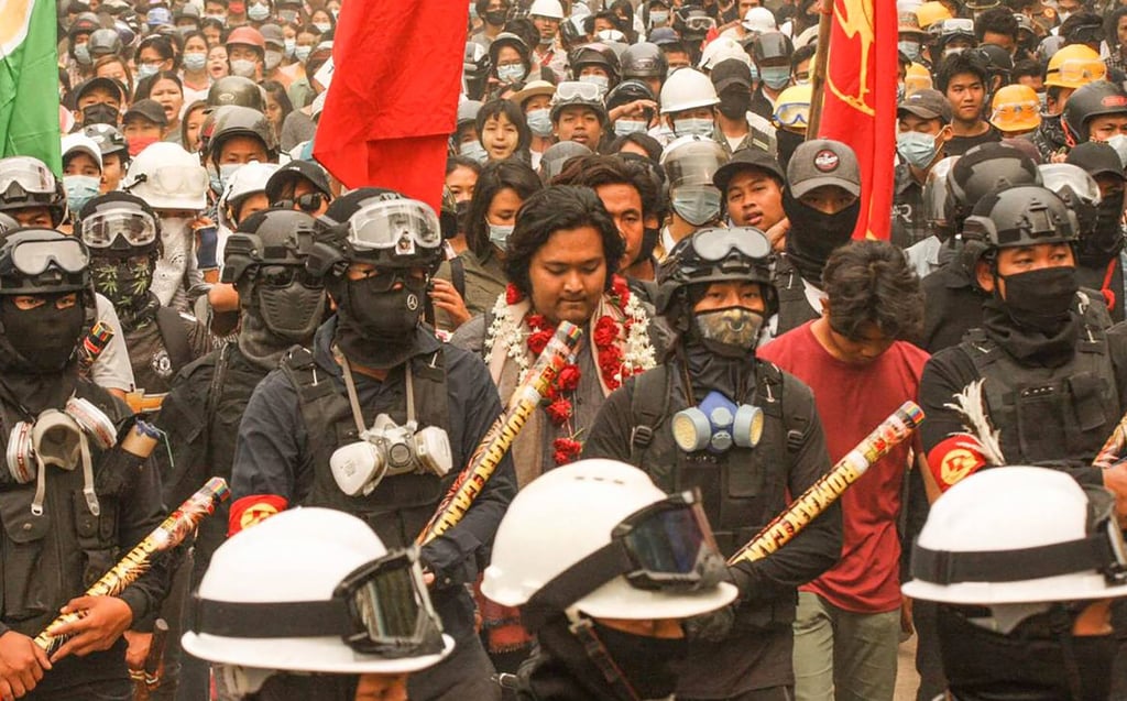 Wai Moe Naing (centre) marches with protesters during an anti-coup rally in Monywa. Photo: Facebook/AFP