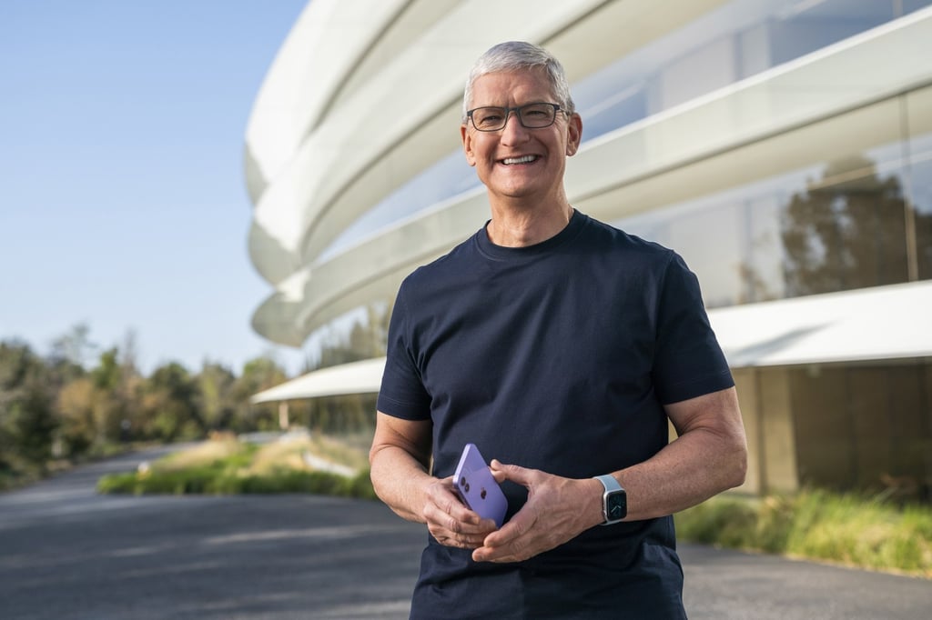Apple CEO Tim Cook holds an iPhone 12 in a new purple finish during a special event at Apple Park in Cupertino, California, on April 20. Photo: Apple Inc via EPA-EFE