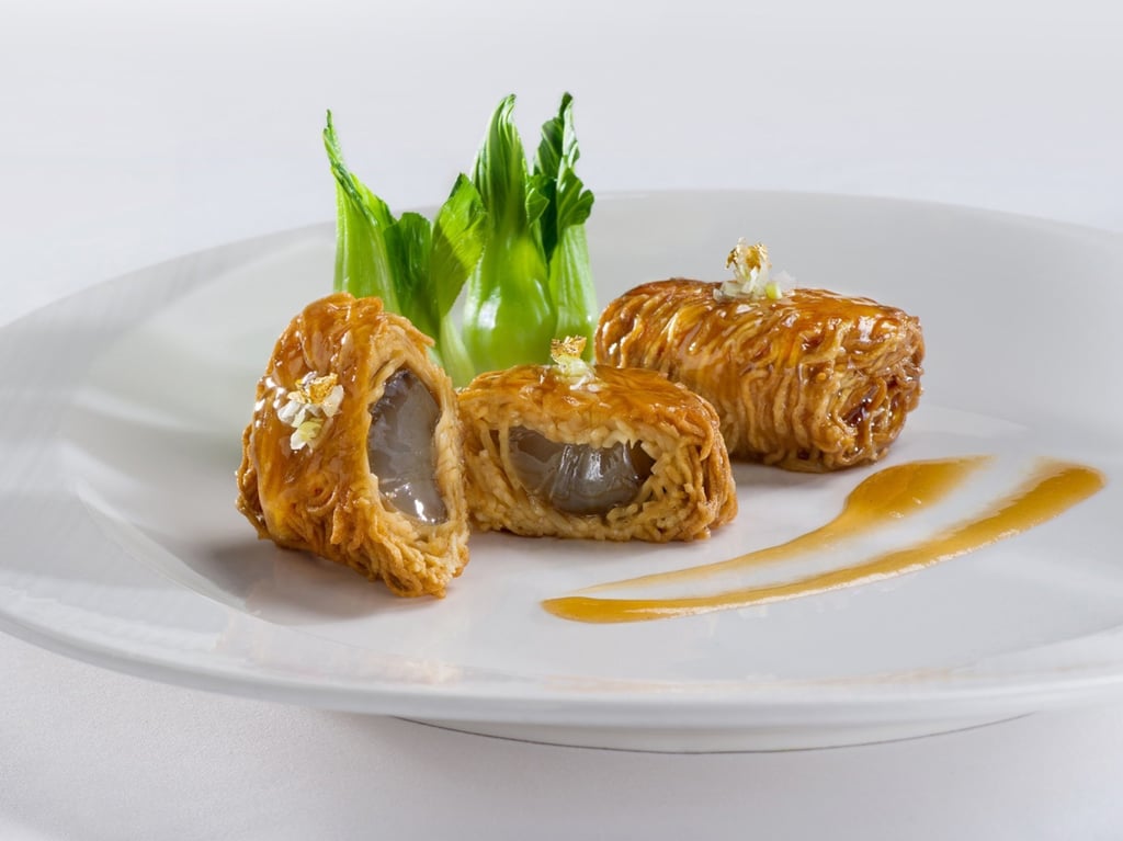 Pan-fried noodles with sea cucumber and shrimp roe in abalone sauce. Photo: Cuisine Cuisine