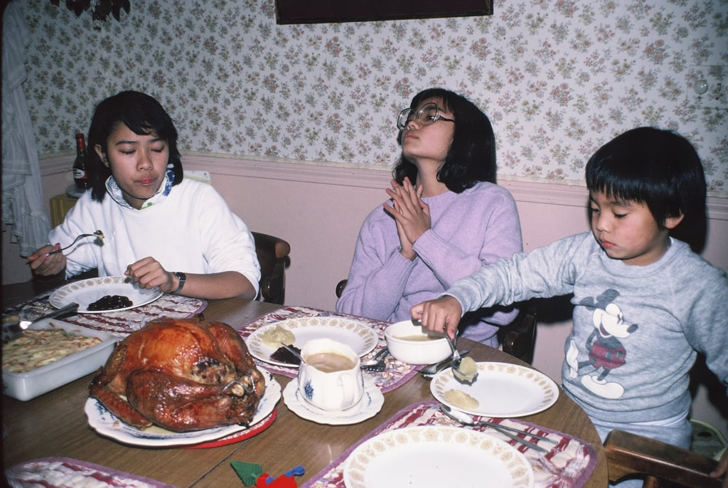 Twelve-year-old Grace Talusan (centre), with her older sister and younger brother, celebrates Thanksgiving at the family home in the suburbs of Boston. Photo: courtesy of Grace Talusan