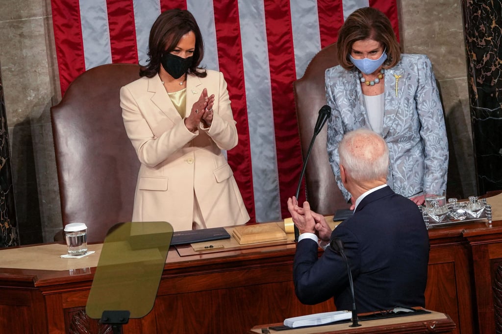 Vice-President Kamala Harris and House Speaker Nancy Pelosi welcome US President Joe Biden before he addresses Congress. Photo: AFP