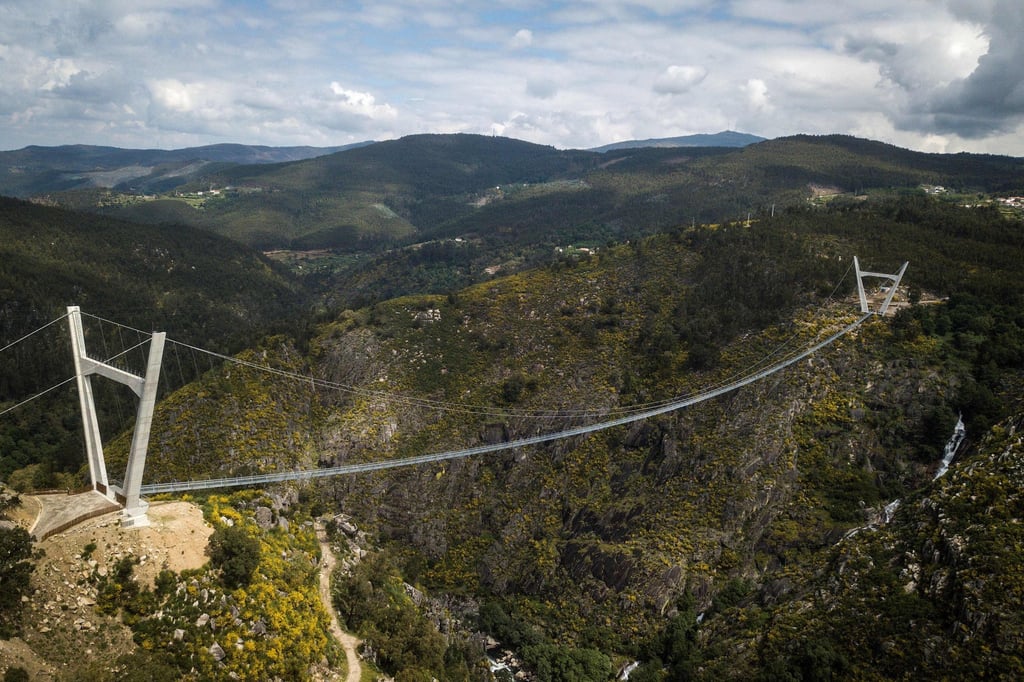 The ‘516 Arouca’ bridge is a 516-metre span 175 metres above the fast-flowing Paiva River in northern Portugal. Photo: Carlos Costa/AFP The ‘516 Arouca’ bridge is a 516-metre span 175 metres above the fast-flowing Paiva River in northern Portugal. Photo: Carlos Costa/AFP