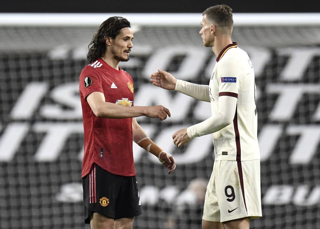 epa09168671 Edison Cavani (L) of Manchester United reacts with Edin Dzeko (R) of Roma after the UEFA Europa League semi final, first leg soccer match between Manchester United and AS Roma at Old Trafford in Manchester, Britain, 29 April 2021. EPA-EFE/PETER POWELL epa09168671 Edison Cavani (L) of Manchester United reacts with Edin Dzeko (R) of Roma after the UEFA Europa League semi final, first leg soccer match between Manchester United and AS Roma at Old Trafford in Manchester, Britain, 29 April 2021. EPA-EFE/PETER POWELL