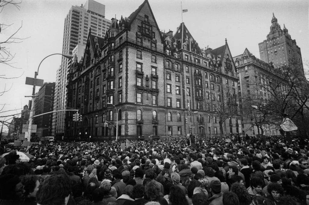 Crowds gather outside the home of John Lennon in New York in December, 1980, after the news that he had been shot and killed. Photo: Getty Images Crowds gather outside the home of John Lennon in New York in December, 1980, after the news that he had been shot and killed. Photo: Getty Images