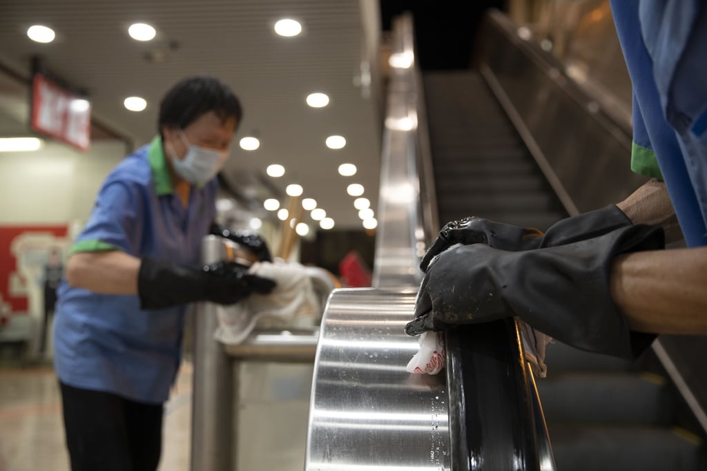 A Food and Environmental Hygiene Department contractor cleans and disinfects a wet market in Hong Kong. Photo: May James/SOPA Images/LightRocket via Getty Images