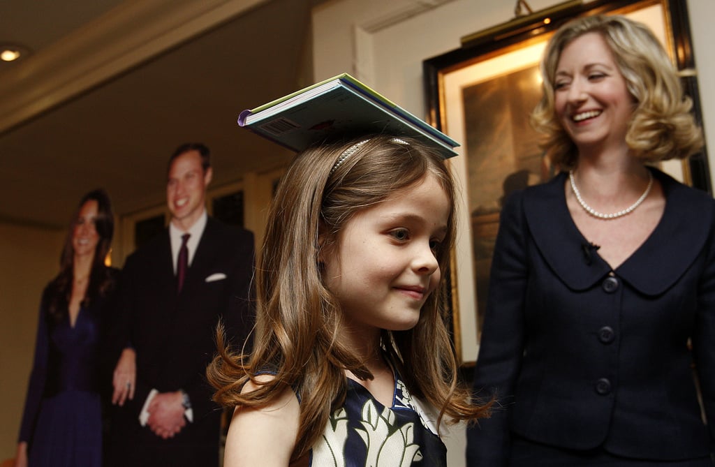 Josephine Shaw, 7, walks with a book on her head to learn deportment during the “A Princess Tea Party” event in April 2011. A dozen girls in frilly dresses attended a “princess boot camp” ahead of this month’s royal wedding. Photo: AP Photo