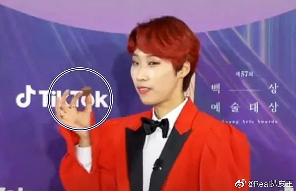 South Korean celebrity Jaejae makes what some people took as an obscene gesture on the red carpet. Photo: Weibo South Korean celebrity Jaejae makes what some people took as an obscene gesture on the red carpet. Photo: Weibo