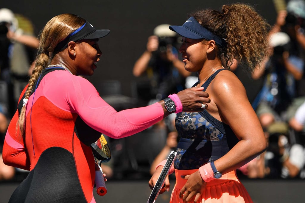 Serena Williams of the US congratulates Japan’s Naomi Osaka on her win in their women’s singles semi-final match on day eleven of the Australian Open tennis tournament in Melbourne on February 18, 2021. Photo: AFP