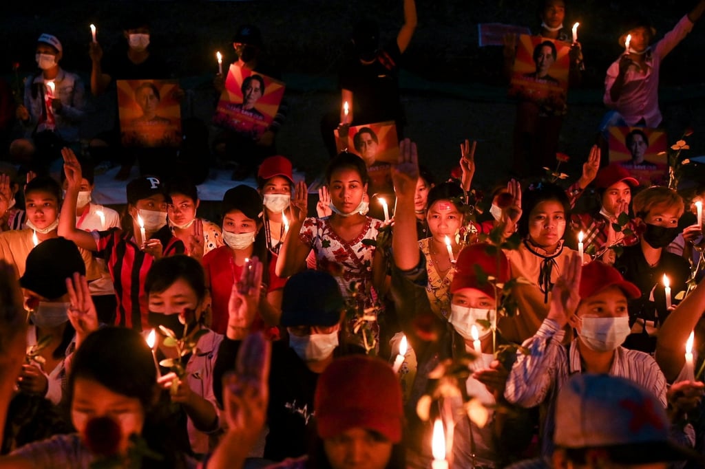 People gather during a candlelight vigil to protest against the military coup in Yangon, Myanmar, on February 21, 2021. Photo: Reuters People gather during a candlelight vigil to protest against the military coup in Yangon, Myanmar, on February 21, 2021. Photo: Reuters