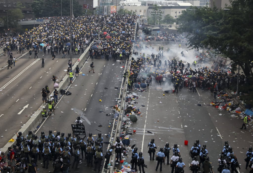 Police fire tear gas at protesters in Admiralty. Photo: K Y Cheng Police fire tear gas at protesters in Admiralty. Photo: K Y Cheng