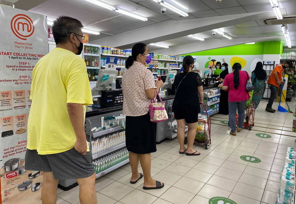 Social distancing at a supermarket in Singapore. Photo: AP