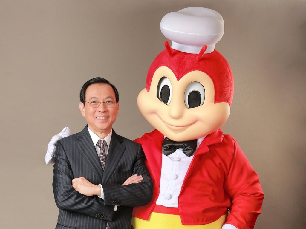 Jollibee founder Tony Tan Caktiong and the chain’s mascot. Photo: Handout