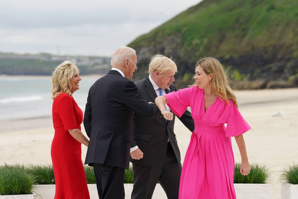 US President Joe Biden (second left) bumps elbows with British Prime Minister’s wife Carrie Johnson. Photo: AFP US President Joe Biden (second left) bumps elbows with British Prime Minister’s wife Carrie Johnson. Photo: AFP