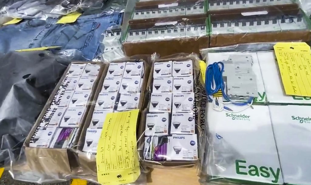 Officers seized HK$12,000 worth of light bulbs and circuit breakers in two rucksacks the pair were carrying. Photo: Facebook Officers seized HK$12,000 worth of light bulbs and circuit breakers in two rucksacks the pair were carrying. Photo: Facebook