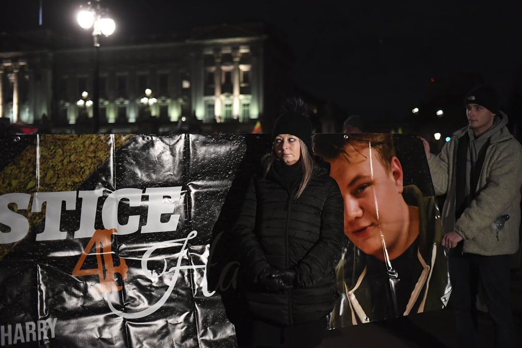 Charlotte Charles, the mother of Harry Dunn, who was killed in a crash by the wife of a US diplomat, is seen in front of a poster with her son’s face during a protest demanding justice for her son in 2019. Photo: AP