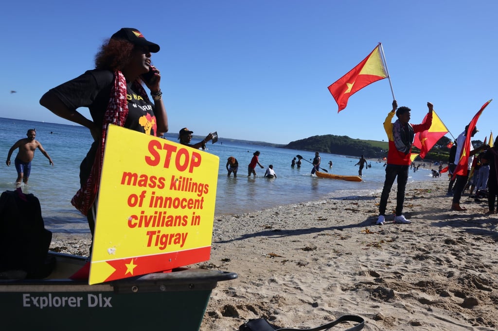 Demonstrators hold Tigray’s flags as they gather by the sea in Falmouth, Cornwall, UK during the G7 summit. Photo: Reuters Demonstrators hold Tigray’s flags as they gather by the sea in Falmouth, Cornwall, UK during the G7 summit. Photo: Reuters