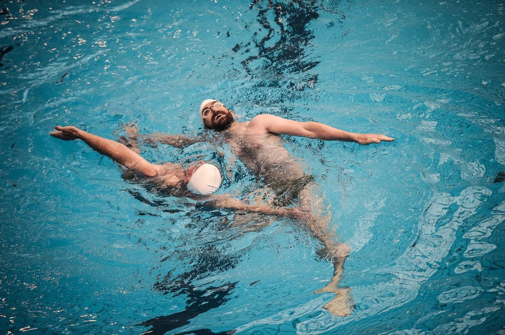 Participants compete in the synchronised swimming contest, which includes both men and women, during the 10th edition of the international Gay Games in Montreuil, east of Paris, on August 8, 2018. Photo: AFP Participants compete in the synchronised swimming contest, which includes both men and women, during the 10th edition of the international Gay Games in Montreuil, east of Paris, on August 8, 2018. Photo: AFP