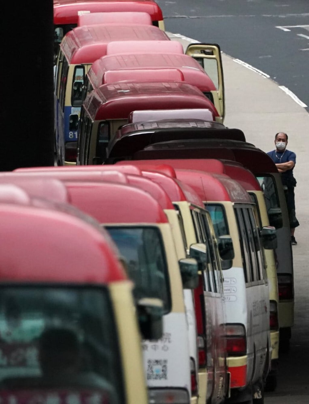 A queue of red minibuses waiting for passengers in Tsz Wan Shan. Photo: Felix Wong A queue of red minibuses waiting for passengers in Tsz Wan Shan. Photo: Felix Wong