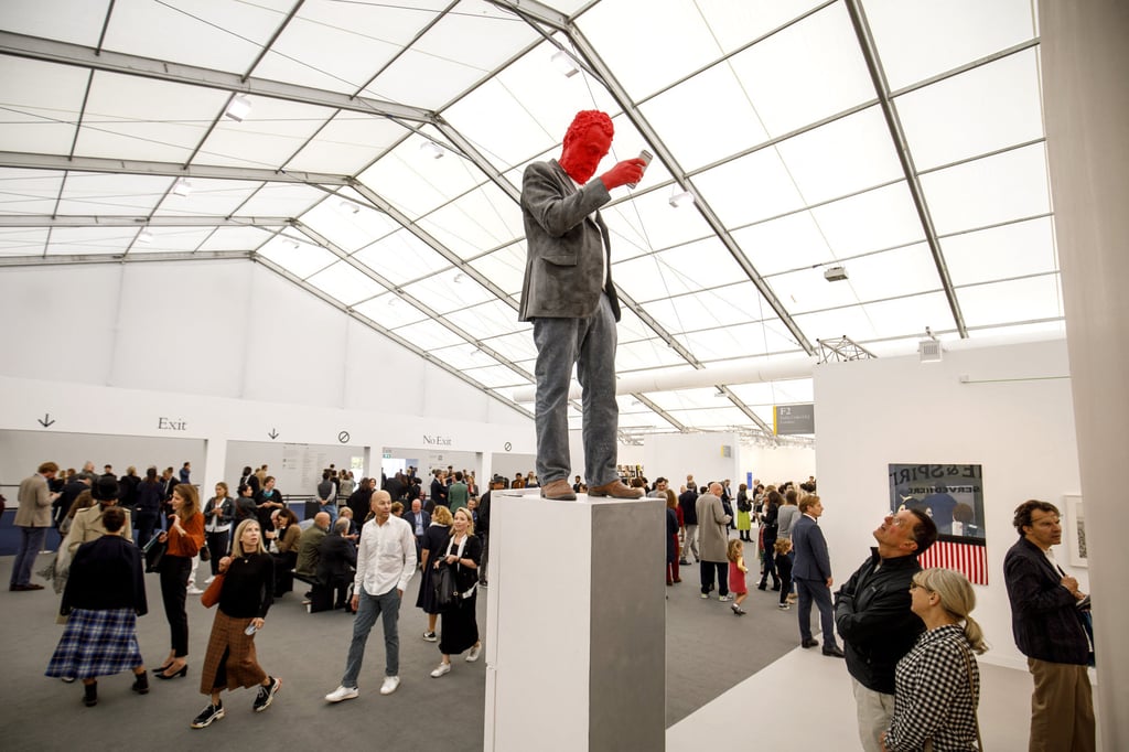 People look at an artwork by Urs Fischer during the Frieze Art Fair in London in 2018. Frieze will hold its first Asian fair in Seoul, South Korea, next year. Photo: AFP People look at an artwork by Urs Fischer during the Frieze Art Fair in London in 2018. Frieze will hold its first Asian fair in Seoul, South Korea, next year. Photo: AFP
