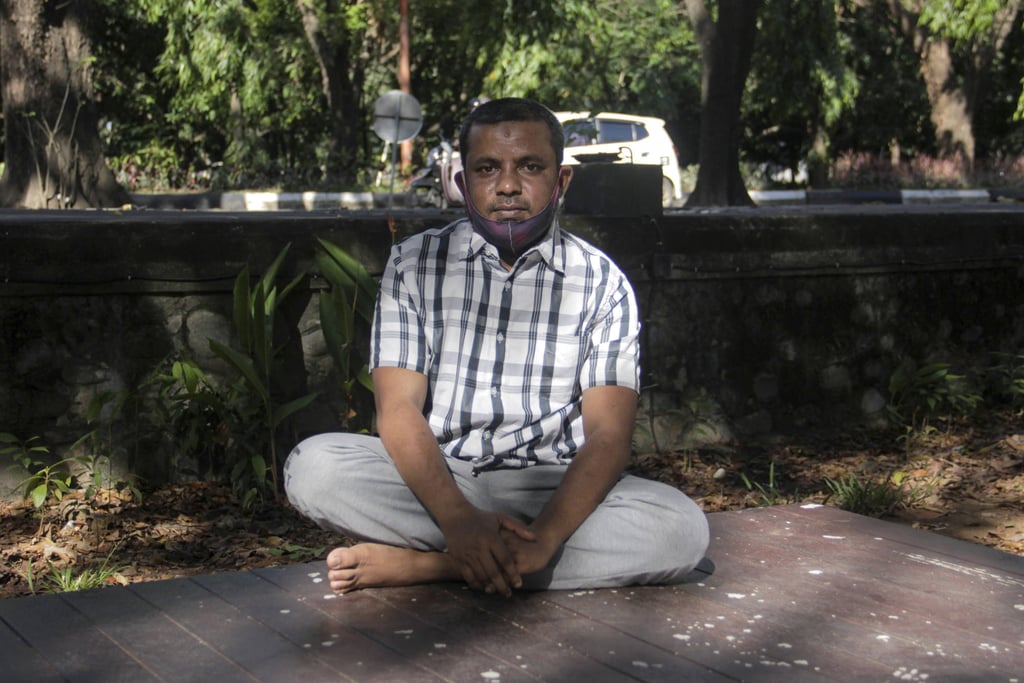 Reyas Alam sits in Makassar’s Sudiang Public Cemetery. Photo: Eko Rusdianto Reyas Alam sits in Makassar’s Sudiang Public Cemetery. Photo: Eko Rusdianto