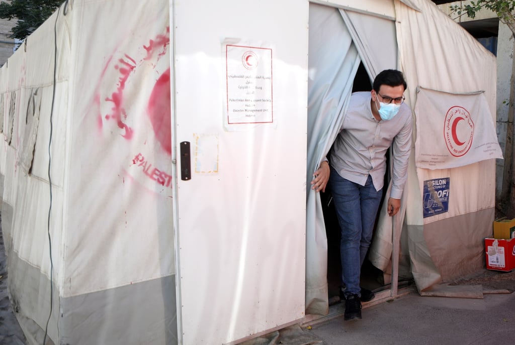A Palestinian man leaves the Palestinian Red Crescent Hospital in the West Bank city of Hebron on Friday. Photo: EPA-EFE
