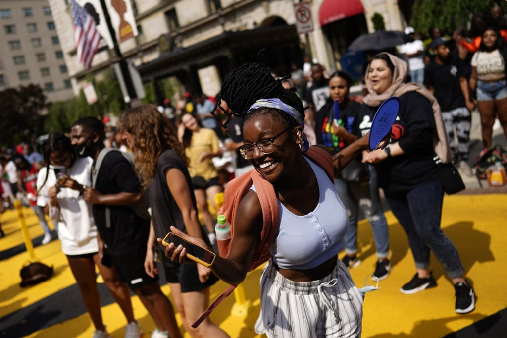 People celebrate Juneteenth on Black Lives Matter Plaza in Washington, DC on Saturday. Photo: EPA-EFE People celebrate Juneteenth on Black Lives Matter Plaza in Washington, DC on Saturday. Photo: EPA-EFE