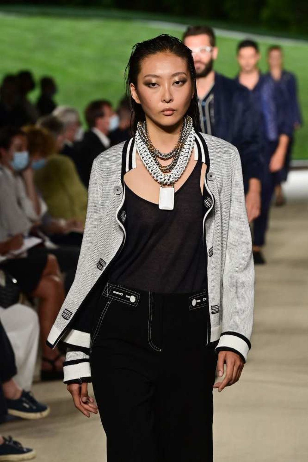 A model presents a creation for Giorgio Armani’s men’s spring/summer 2022 fashion collection on June 21, 2022 during Milan Fashion Week. Photo: AFP