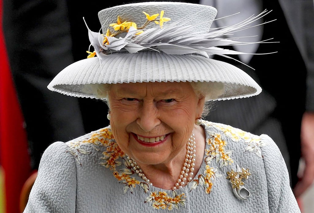Britain’s Queen Elizabeth smiles as she attends day three of the Royal Ascot horse racing meet, in Ascot, west of London, in June 2019. Photo: AFP