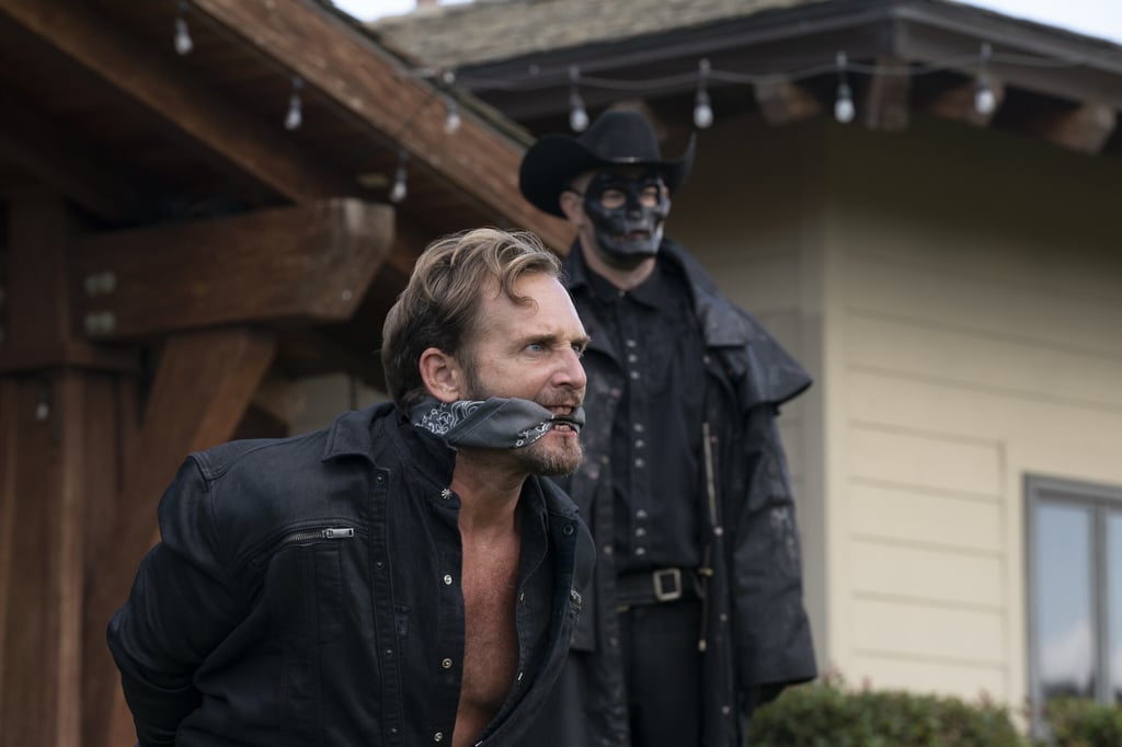 Josh Lucas (front) and a Purger in a still from The Forever Purge.