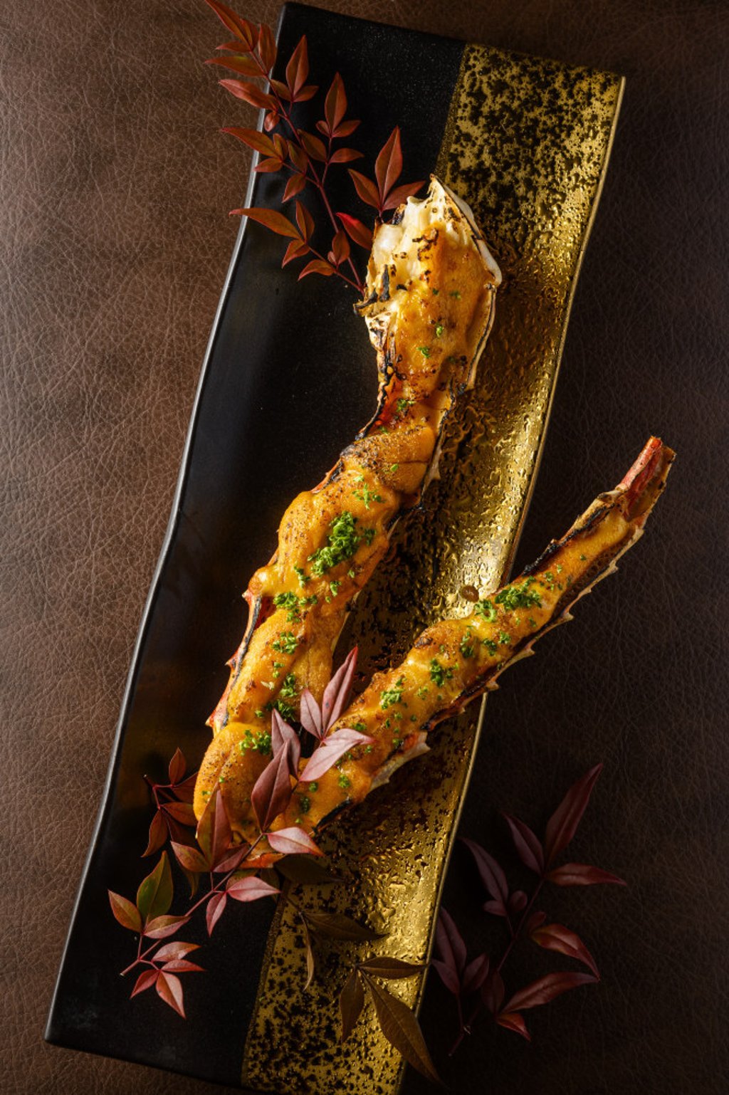 Grilled king crab legs with sea urchin sabayon sauce. Photo: Izakaya by K