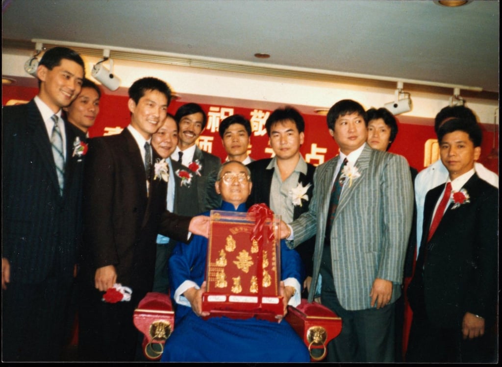 Yu Jim-yuen sits with some of his students, including Sammo Hung on his right and Yuen Biao on his left, at his birthday party in 1988. Photo: SCMP