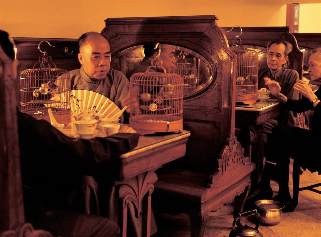 Men with their songbirds in a Hong Kong teahouse. Photo: Frank Fischbeck Men with their songbirds in a Hong Kong teahouse. Photo: Frank Fischbeck
