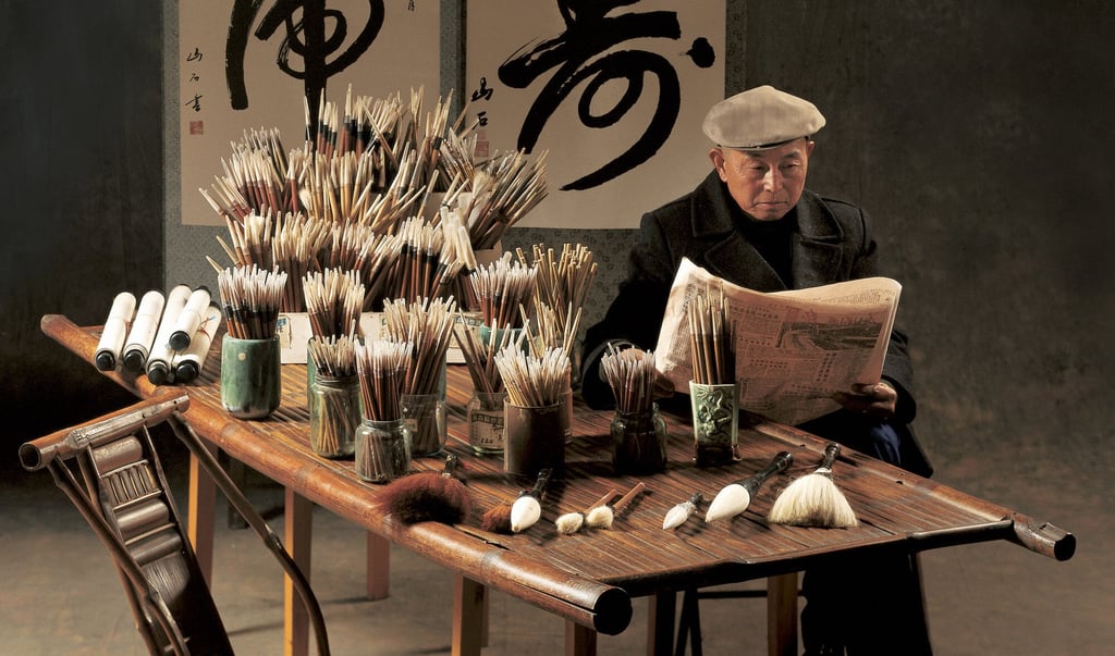 A calligrapher at his stall. Photo: Frank Fischbeck A calligrapher at his stall. Photo: Frank Fischbeck
