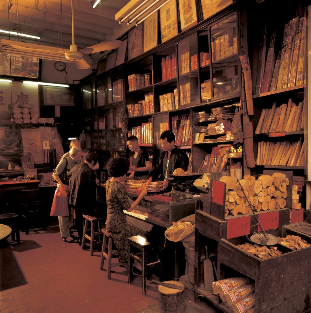 Customers buy scented agarwood in a local shop. Photo: Frank Fischbeck Customers buy scented agarwood in a local shop. Photo: Frank Fischbeck