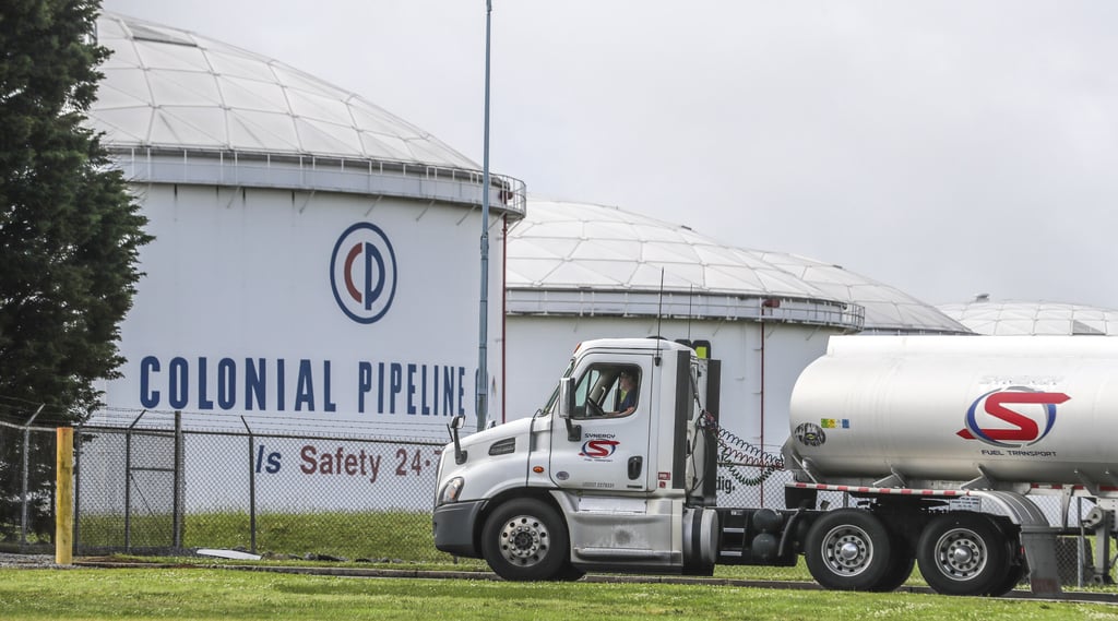 Gasoline tankers pass by the Colonial Pipeline storage tanks located in Austell, Georgia, on May 10, as they enter the Marathon Powder Springs Terminal. Photo: The Atlanta Journal-Constitution/TNS Gasoline tankers pass by the Colonial Pipeline storage tanks located in Austell, Georgia, on May 10, as they enter the Marathon Powder Springs Terminal. Photo: The Atlanta Journal-Constitution/TNS
