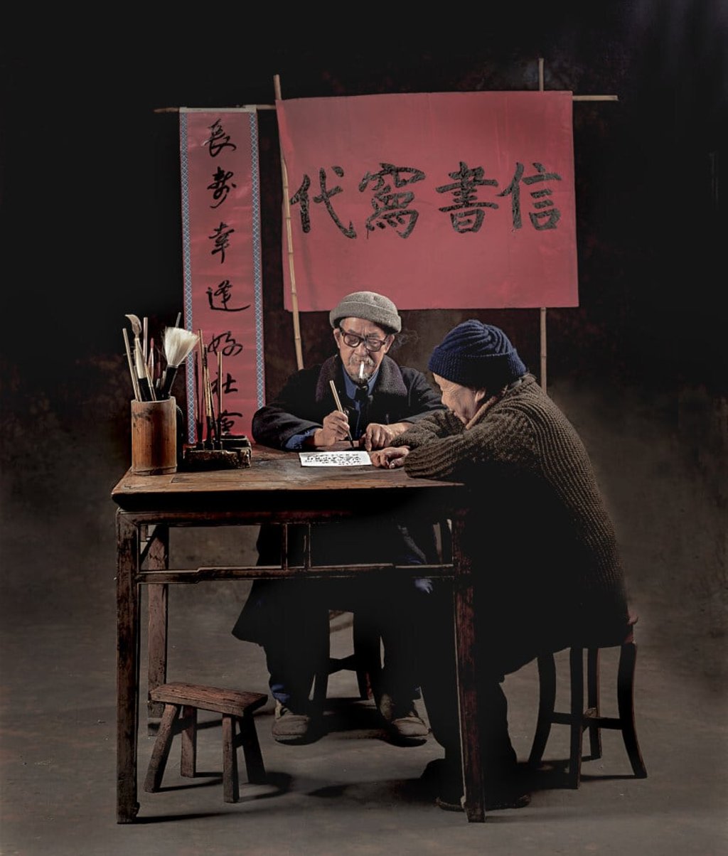A scribe assists an old woman. Photo: Frank Fischbeck A scribe assists an old woman. Photo: Frank Fischbeck