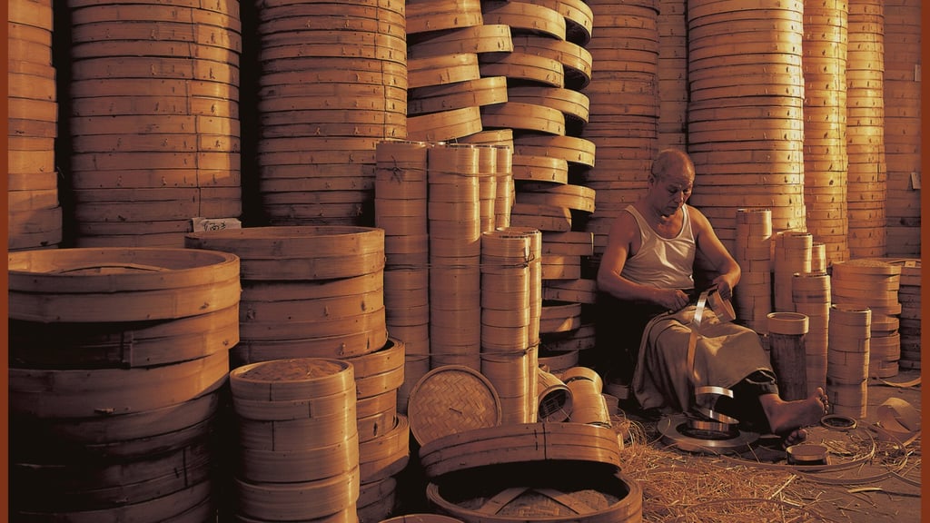 A worker making a bamboo dim sum steamer. Photo: Frank Fischbeck A worker making a bamboo dim sum steamer. Photo: Frank Fischbeck
